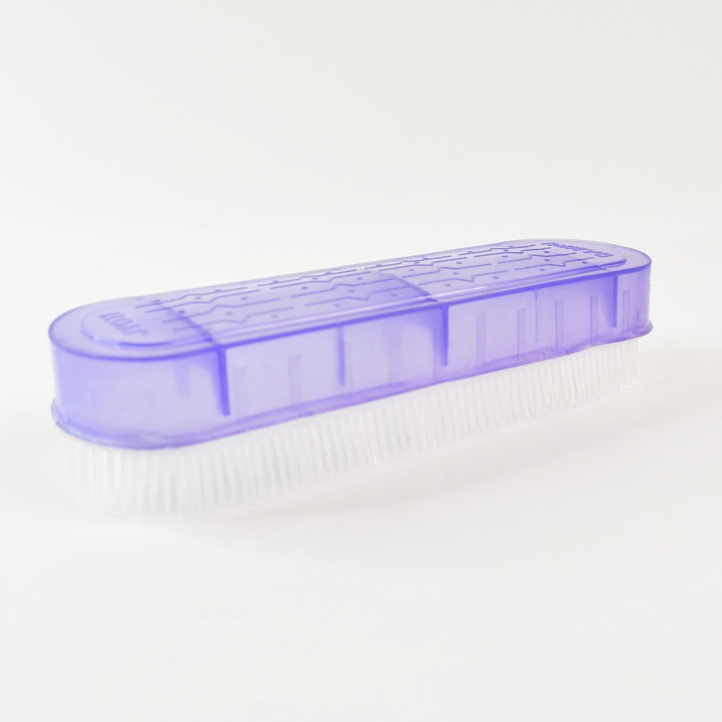 Compact multipurpose laundry brush fitting easily in storage