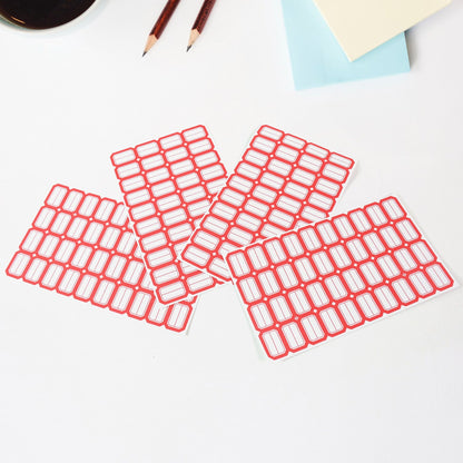 Writable label sheets on desk used for labeling office items