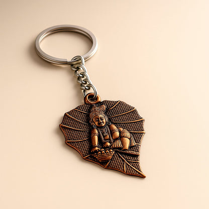 Bal Krishna keychain with antique bronze finish and peepal leaf design