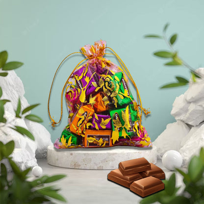 Mesh fabric potli bag with shimmering drawstring closure holding premium chocolates