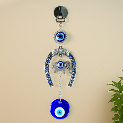 Decorative evil eye hanging with elephant and horseshoe motif wind chime