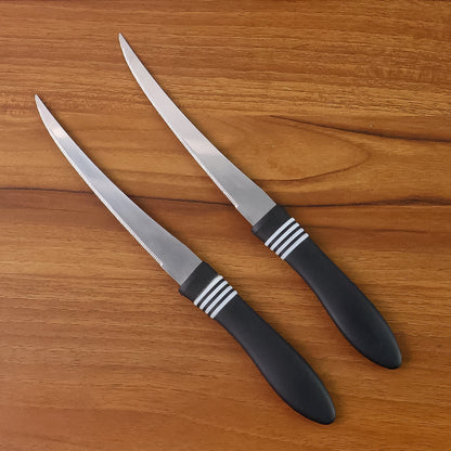 Ergonomic black ABS handle of serrated kitchen knife for comfortable grip