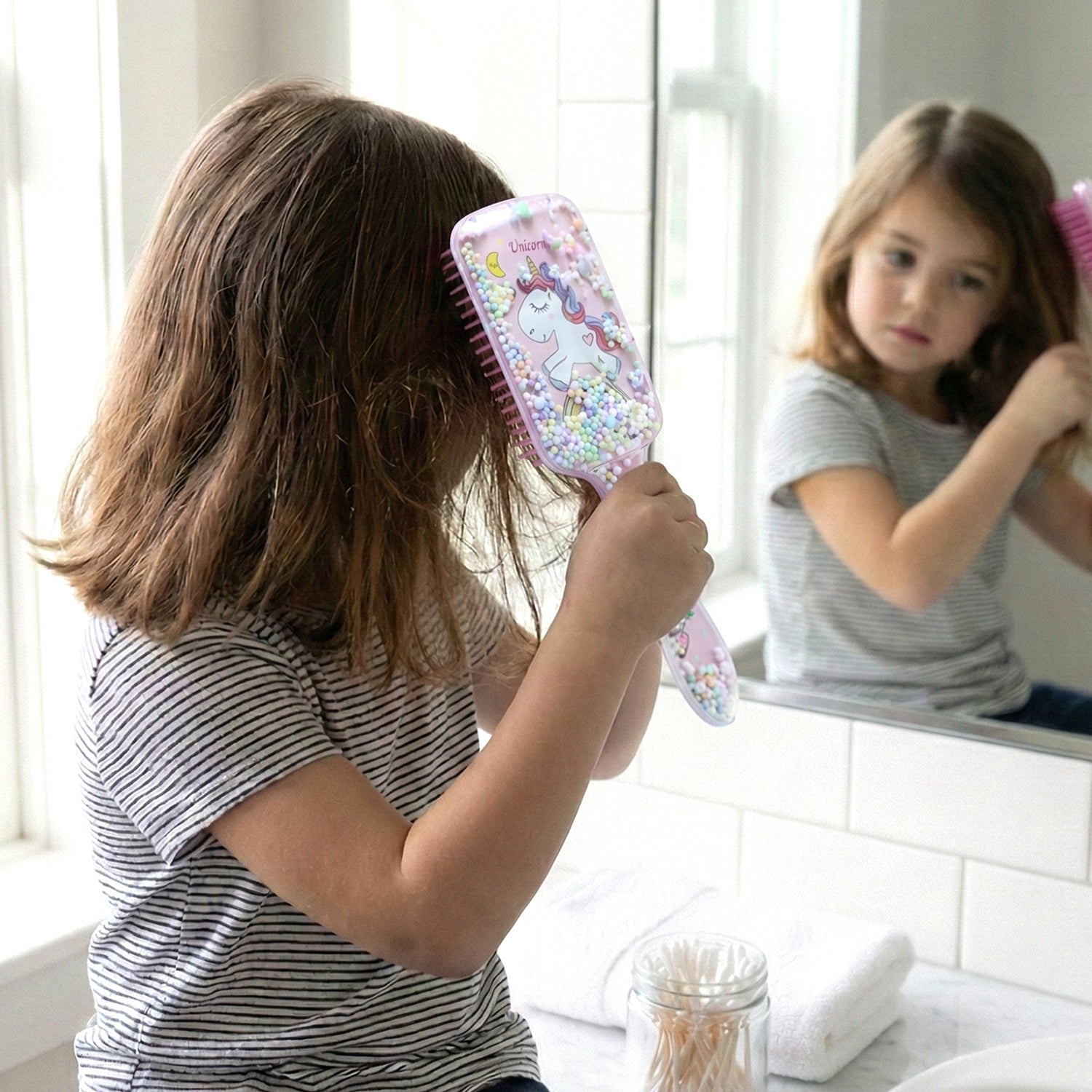 Children's hair care brush with comfortable handle