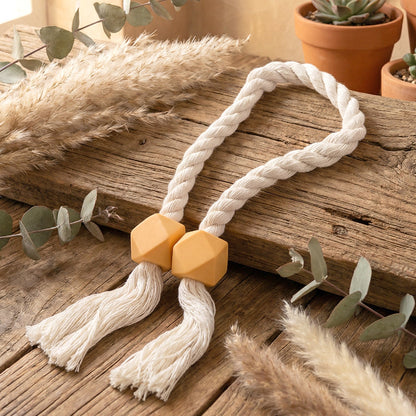 Decorative magnetic curtain tieback with elegant geometric beads.