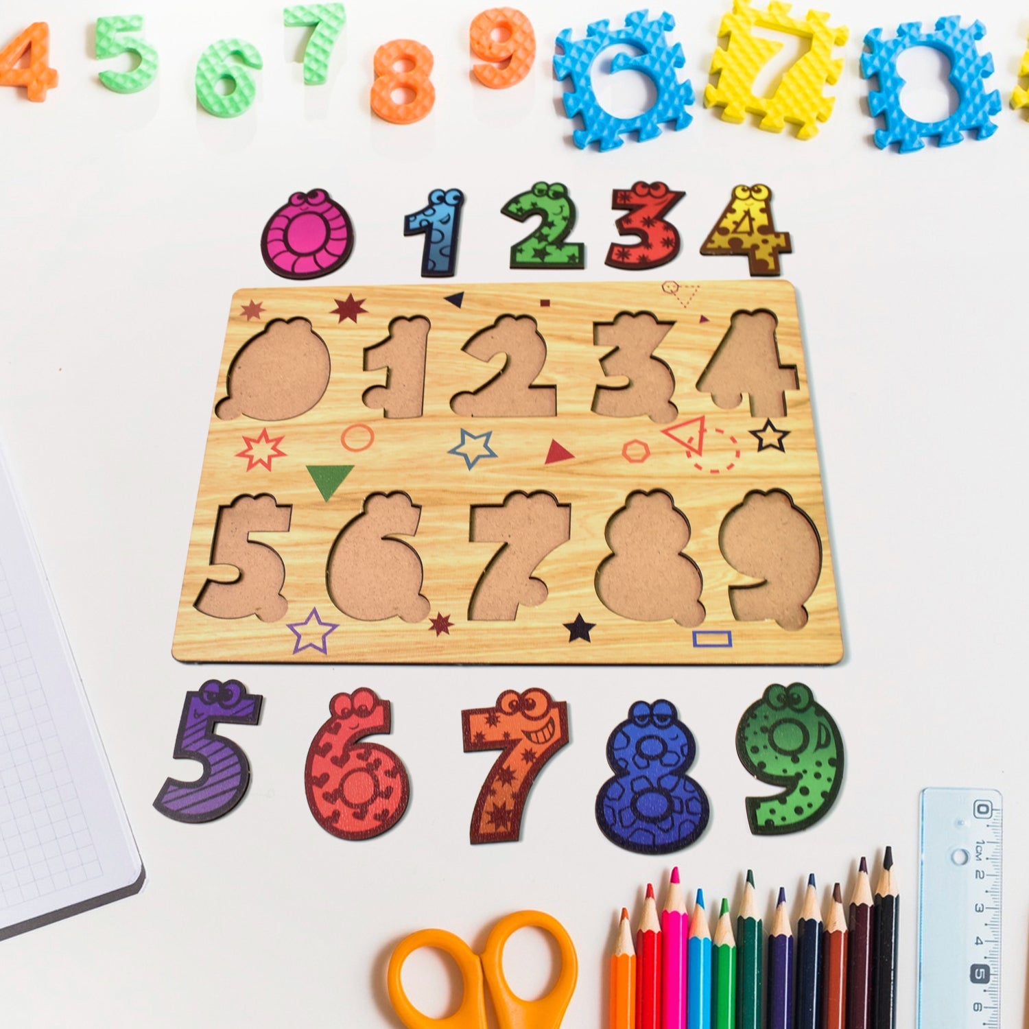 Wooden puzzle board displaying animal-shaped pieces with knobs