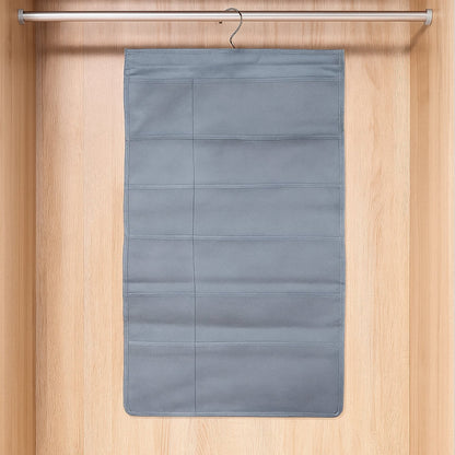 Foldable under garment organizer bag with multiple pockets hanging in closet