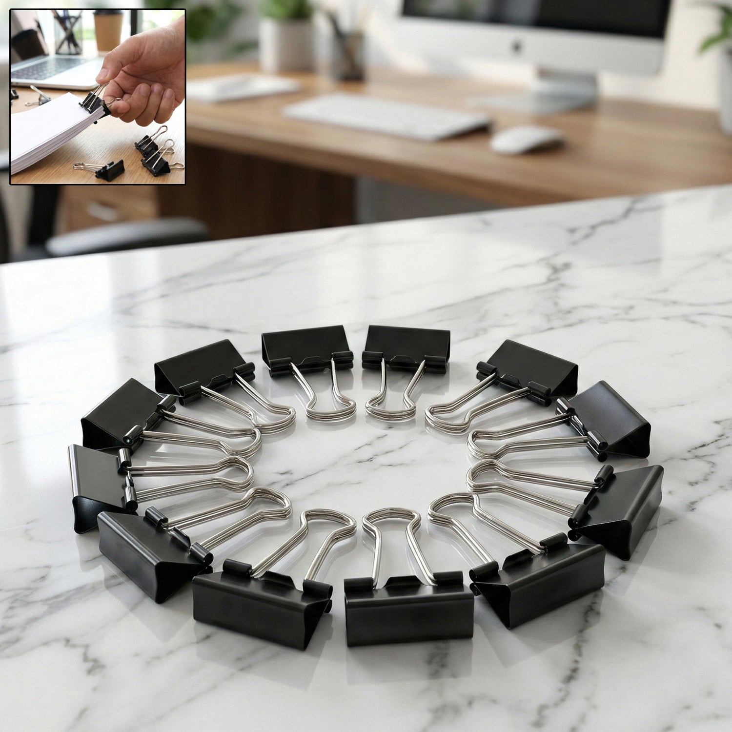 Close-up of 25mm black binder clips holding sheets of paper tightly