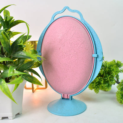 Close-up of reflective fruit dish highlighting mirror surface