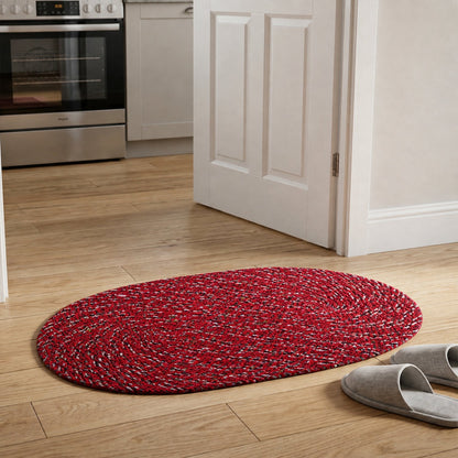 Outdoor style red oval floor mat with textured surface