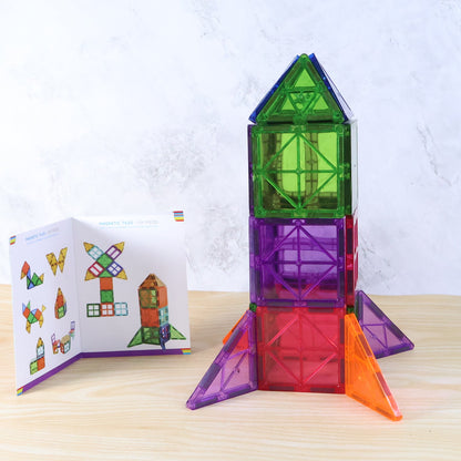 26-piece magnetic building tiles set assembled into colorful creative shapes
