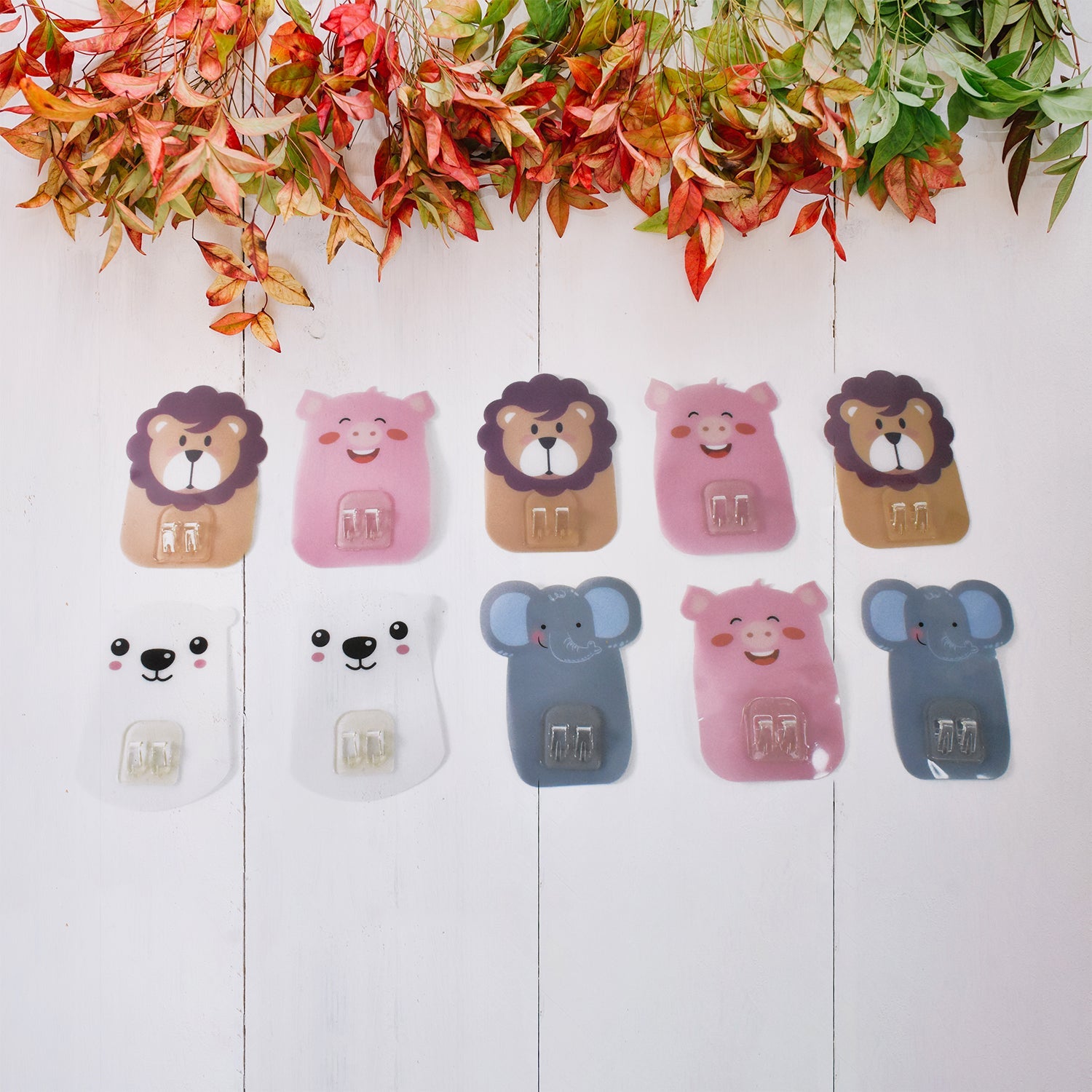 Fun and colorful cartoon hooks mounted on the wall for kids' playroom