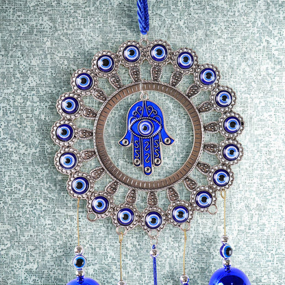 Close-up of detailed alloy and glass beadwork on Om Evil Eye chime