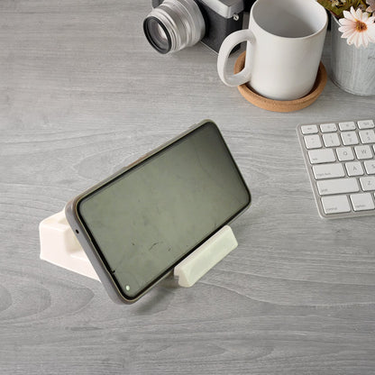 Closeup of plastic mobile phone stand with charging port