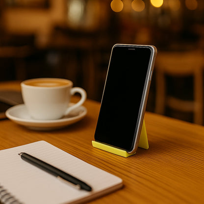 Close-up of pen holder slots integrated into plastic mobile phone stand