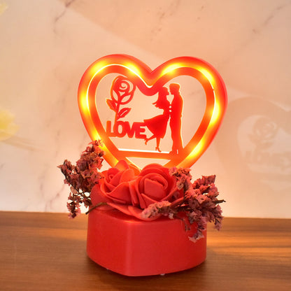 Close-up of heart-shaped love couple ornament with rose base