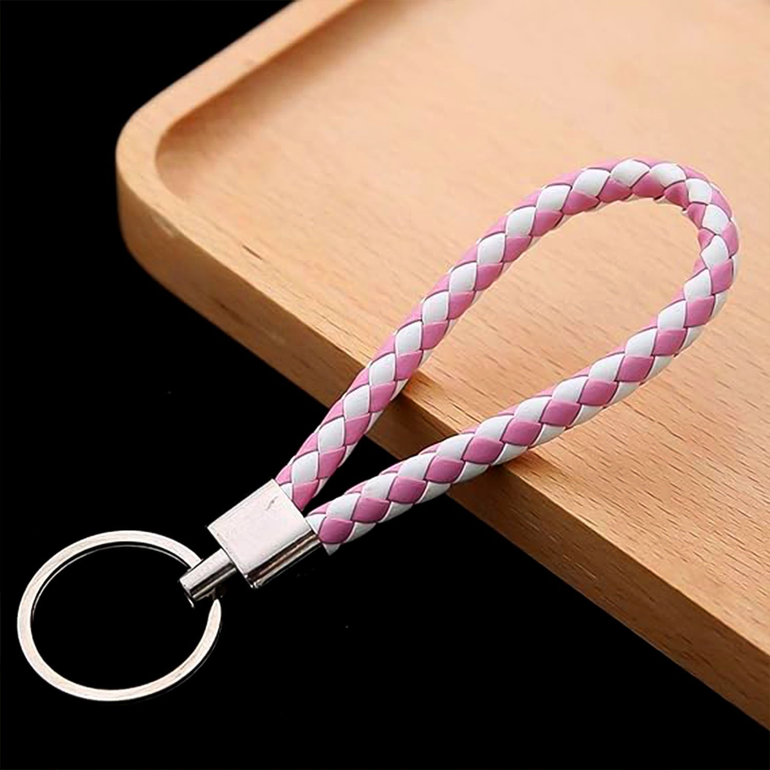 Braided leather keychain showing comfortable hand strap loop for easy carrying