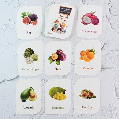 Flashcards arranged on table showing bright and realistic fruit images