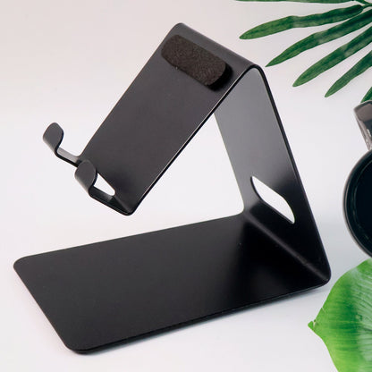 Compact metal mobile stand angled to hold a smartphone securely