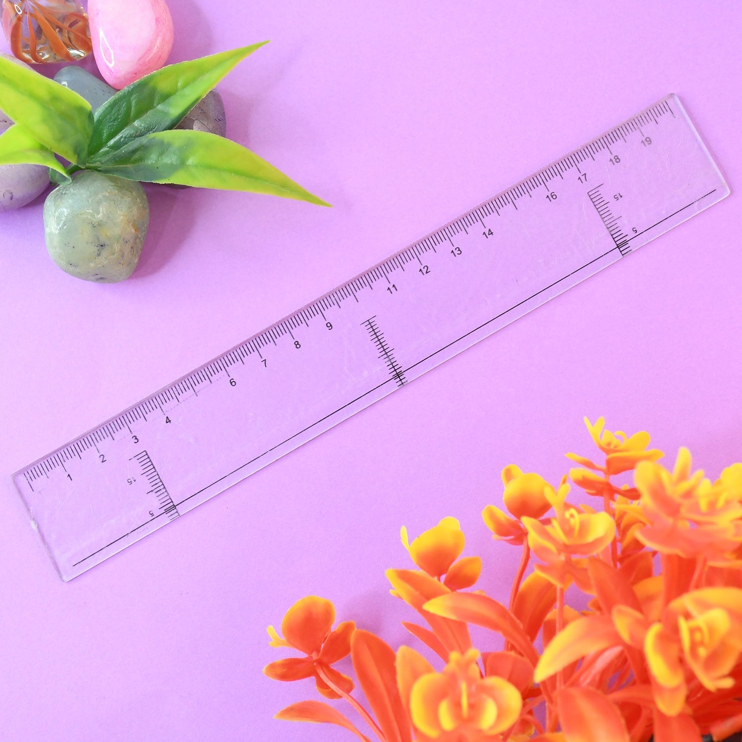 Crystal clear 20 cm plastic ruler placed on white background
