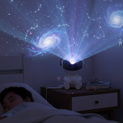 Astronaut themed galaxy star projector night light lamp on surface