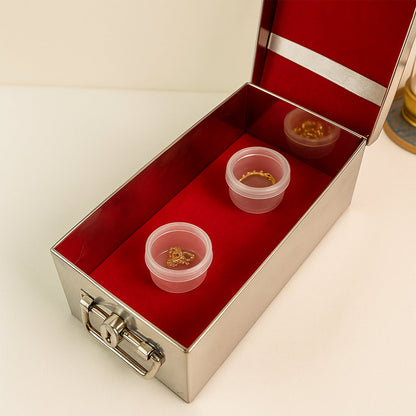 Full front view of the stainless steel Jewellery Storage Box with its luxurious red velvet interior.