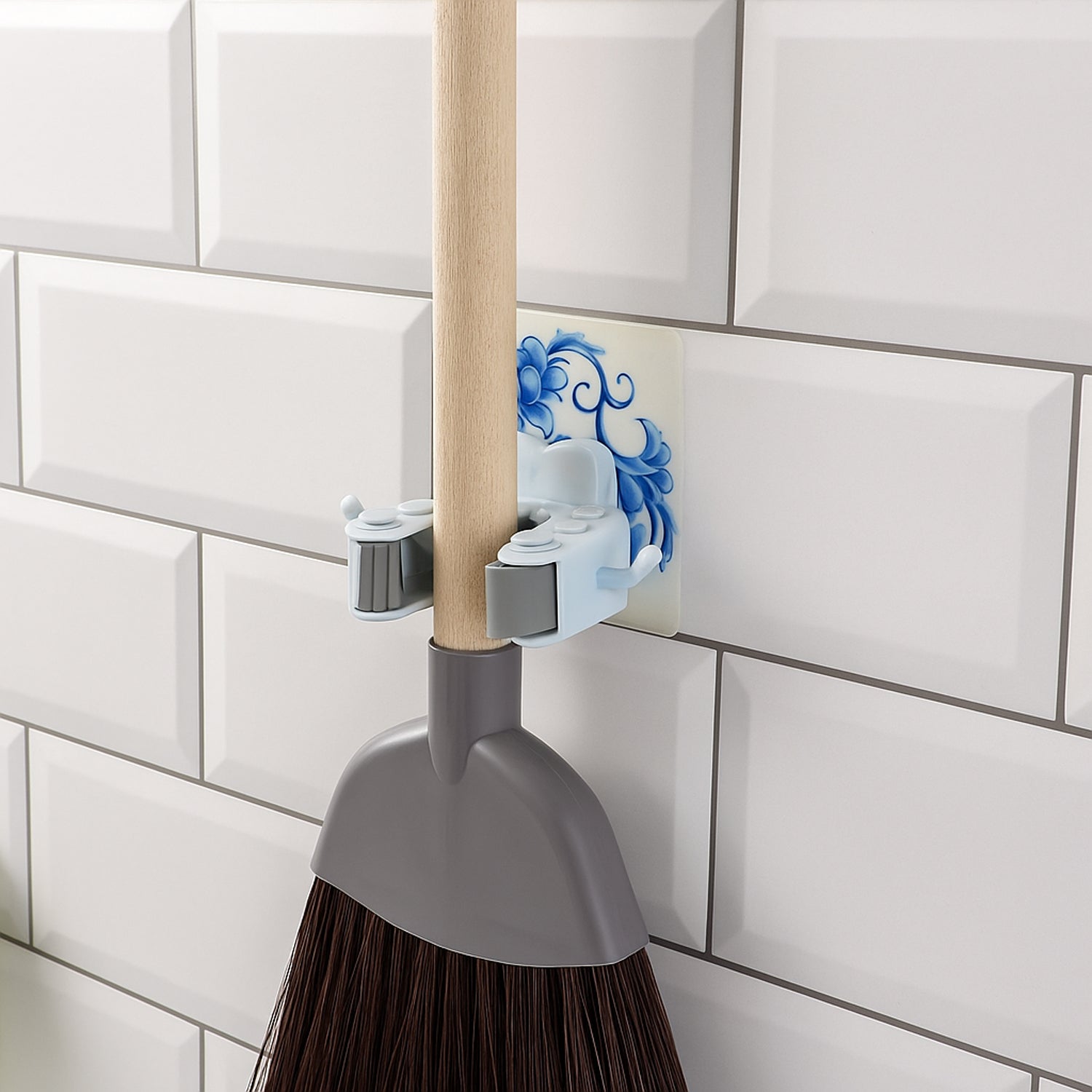Back view of wall mounted mop and broom holder showing strong adhesive