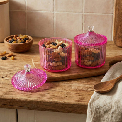 Set of transparent plastic dry fruit storage jars with decorative lids
