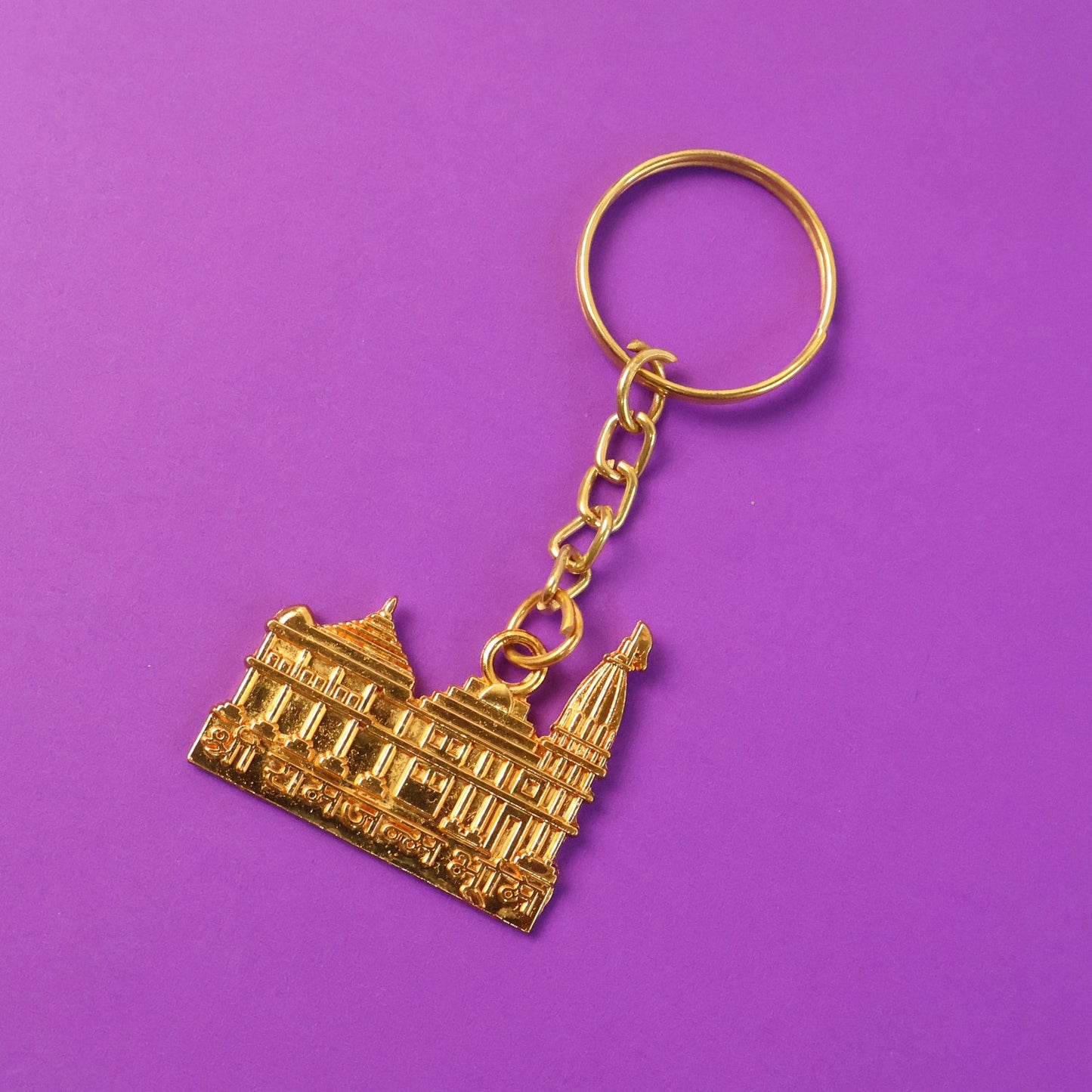 Ram Mandir keychain hanging with keys, showcasing metal craftsmanship