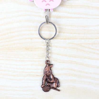 Metal Bal Krishna keychain attached to a set of keys