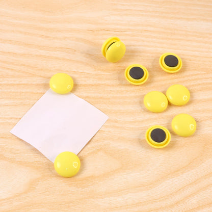 Side profile of a white round magnet, highlighting its compact and sleek design.