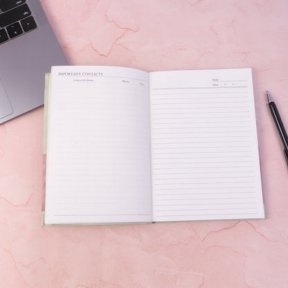 Open hardbound diary notebook prepared for writing notes