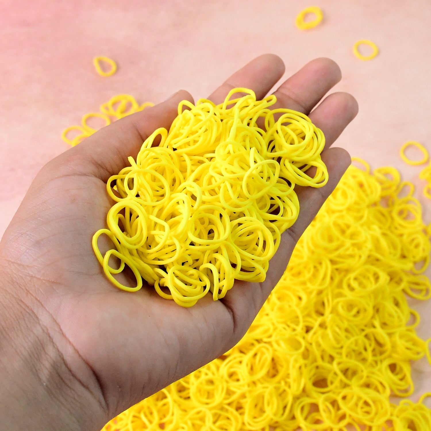 Bright orange elastic rubber bands bundled together