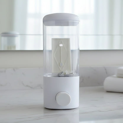 Manual push button soap dispenser installed on wall