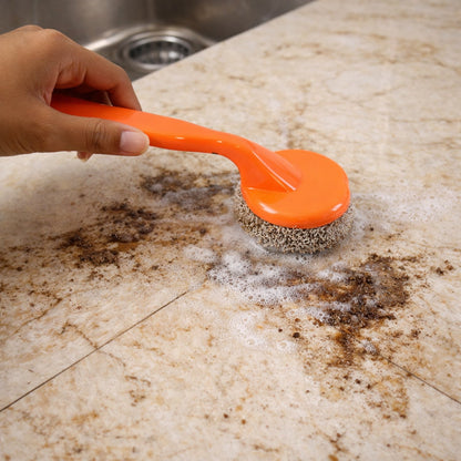 Close-up of scrubber brush head showing durable heavy duty cleaning surface