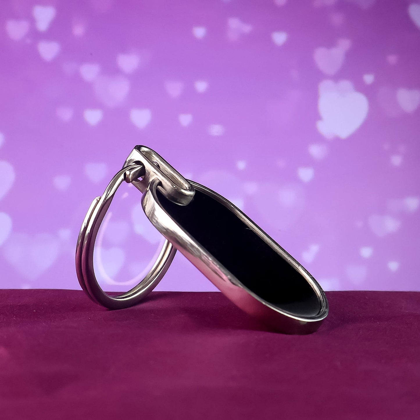 Premium executive oval keychain with smooth silver and black design