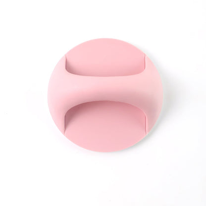 Plastic adhesive handle grip attached on a drawer