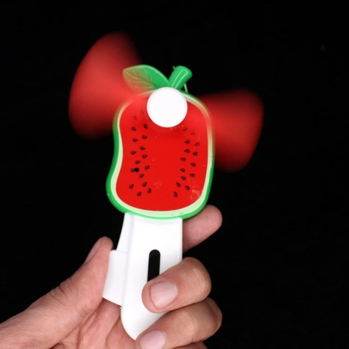 Mini cooling fan for kids with safe, soft blades in fruit shapes