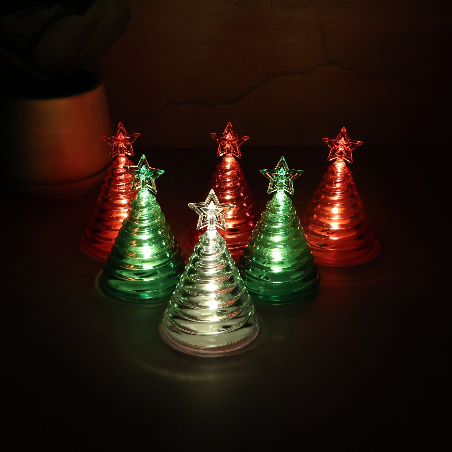 Set of 6 LED Christmas Tree Decorative Lights with star tops creating festive ambiance