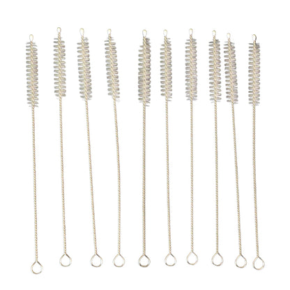 Nylon bristles cleaning a reusable metal straw with the brush from the set