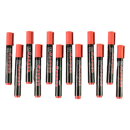 Writing with red ink marker on different surfaces including plastic