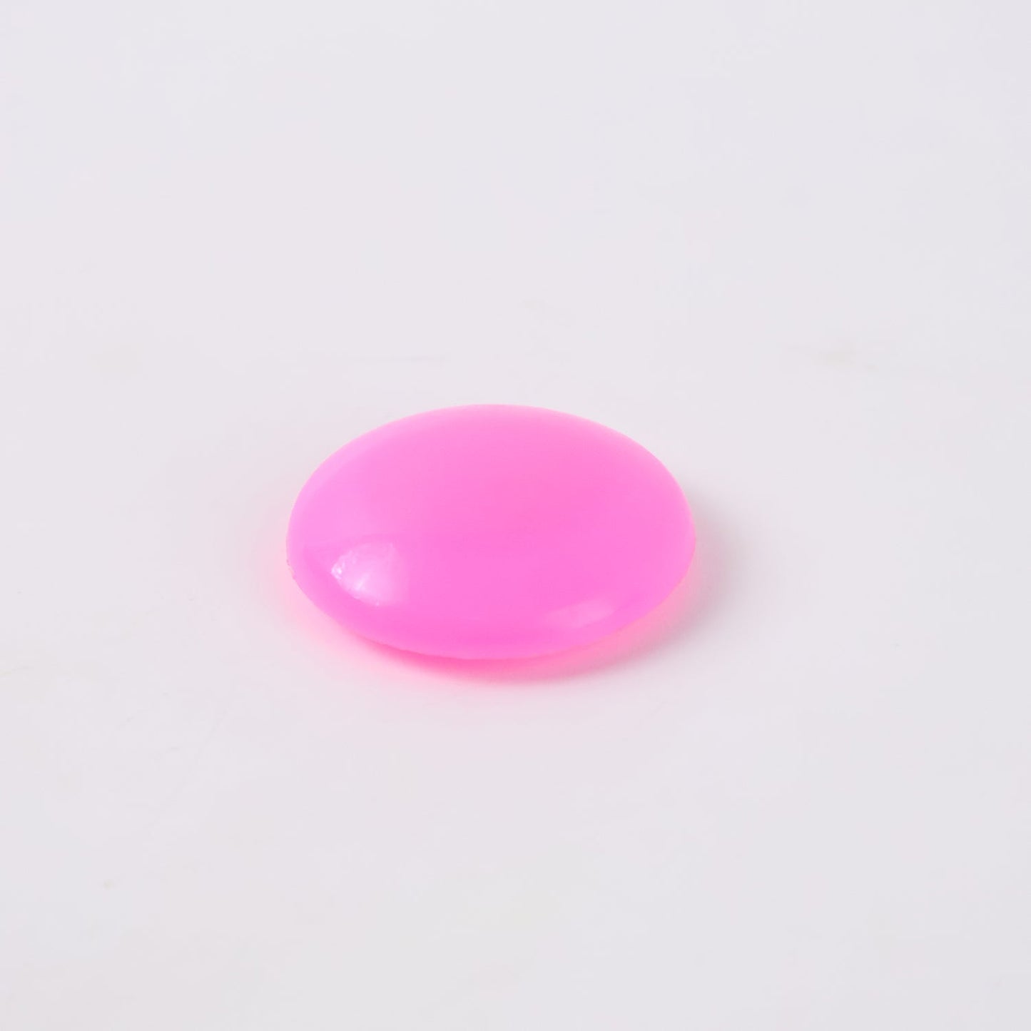 Set of pink plastic tack board magnet buttons displayed