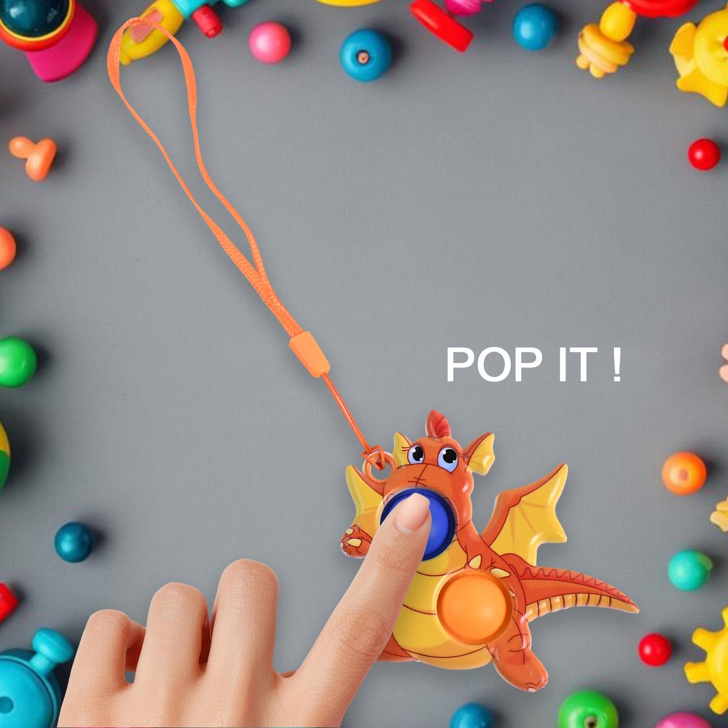 Hand pressing dual silicone bubbles on dragon push pop fidget toy
