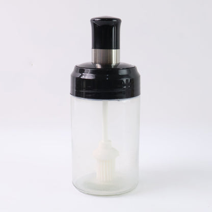 Crystal clear oil dispenser bottle featuring silicone basting brush applicator
