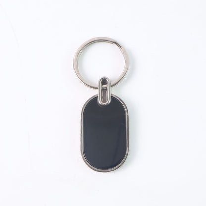 Monogram edge silver and black oval metal key holder accessory