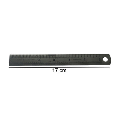 Close-up showing detailed markings on steel measuring ruler