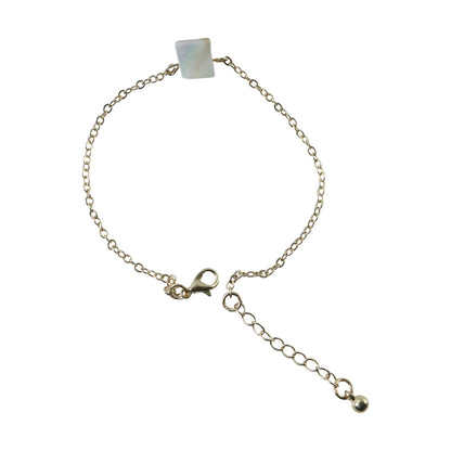 Detailed view of square stone charm on adjustable chain bracelet