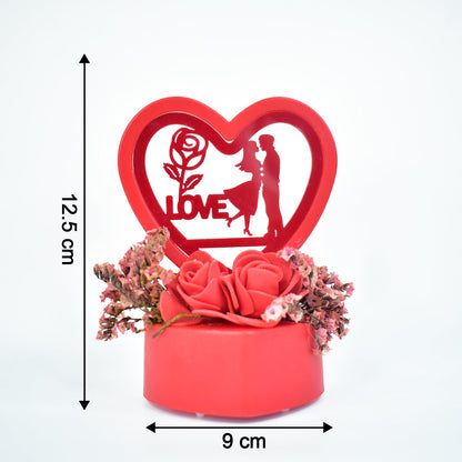 Heart-shaped love couple decor with glowing light and roses base