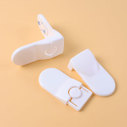 Set of two baby safety locks installed on drawers to childproof
