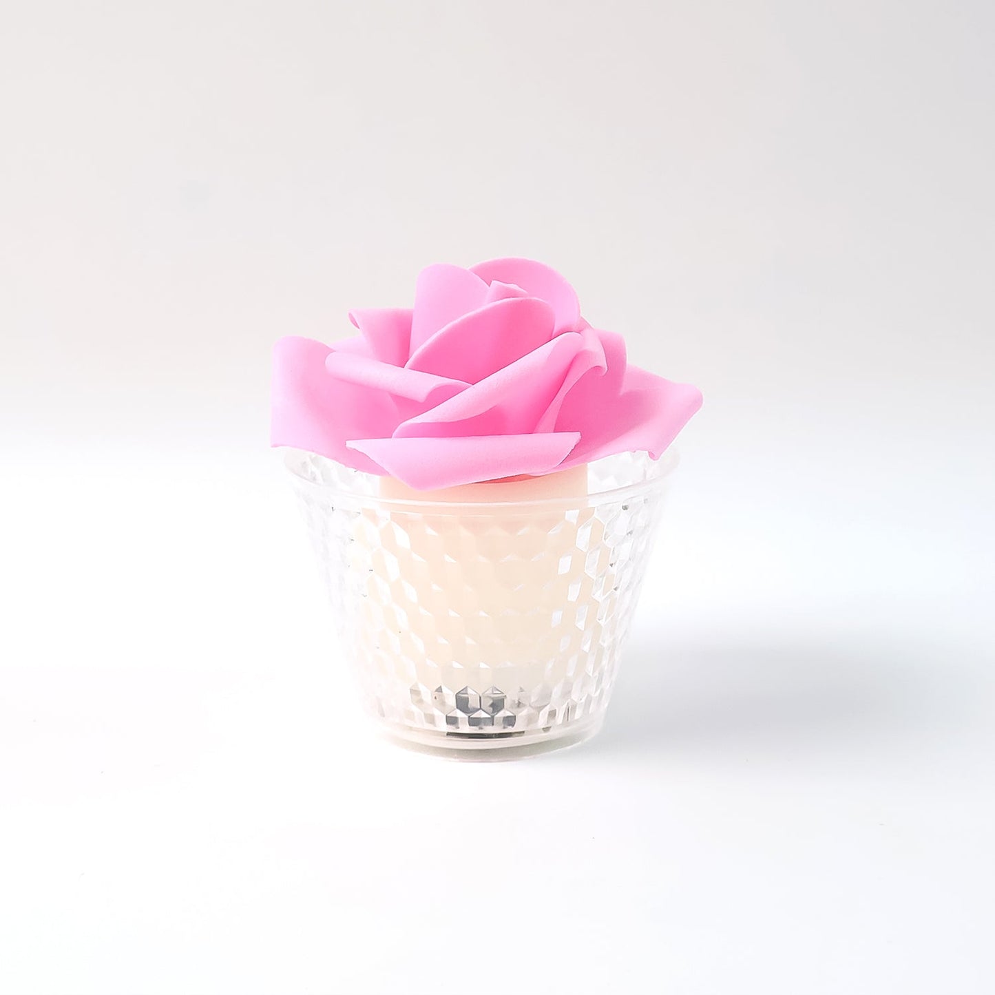 Elegant LED rose flower tealight lamps glowing softly in a set