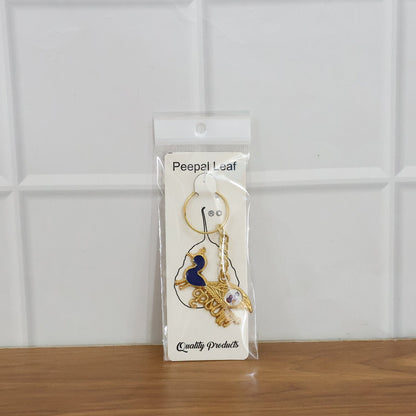 Krishna keychain with multiple charms and sturdy metal key ring